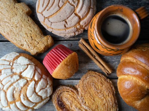 mexican desserts, mexican sweet bread and coffee on a table