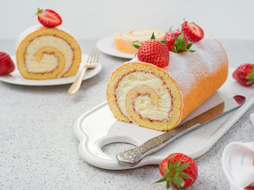 Tasty roll cake stuffed with cream cheese ,decorated with fresh
