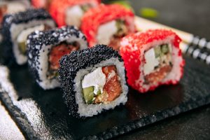 Maki sushi with red and black tobiko