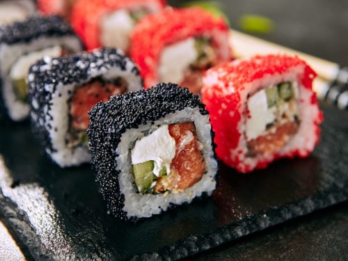 Maki sushi with red and black tobiko