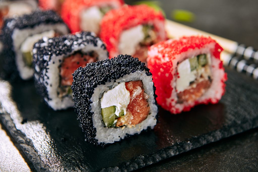 Maki sushi with red and black tobiko