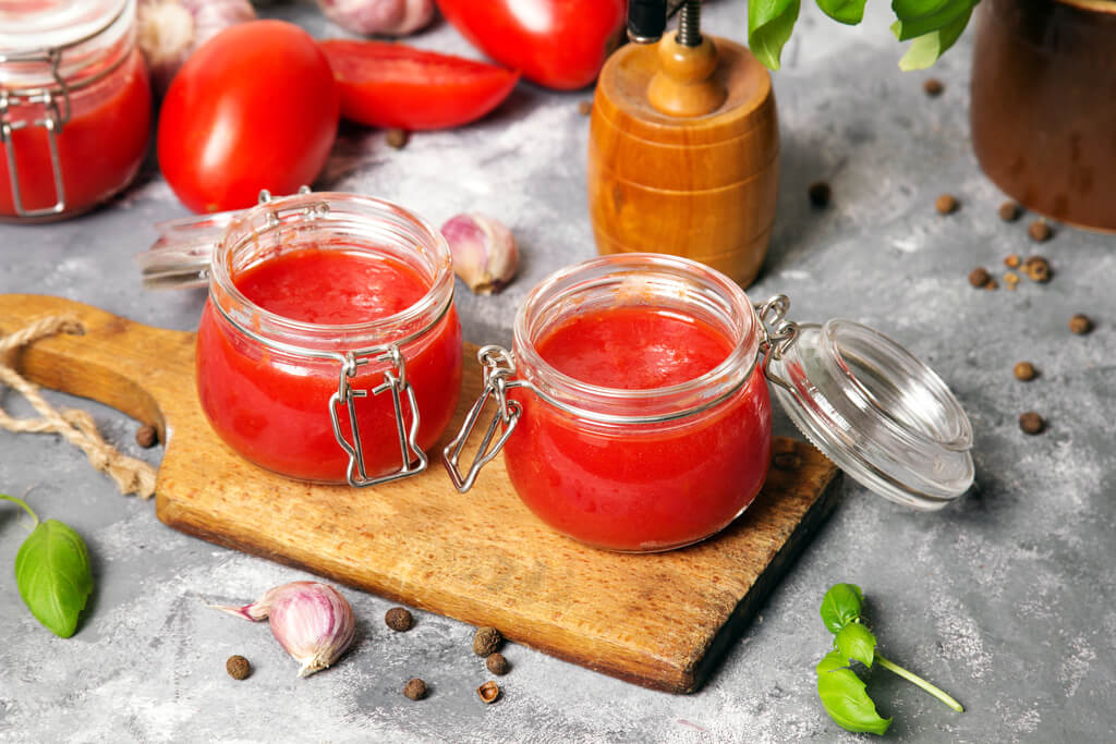 homemade tomato puree in airtight jars