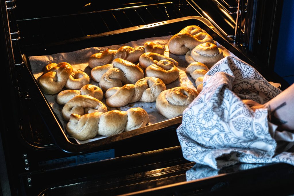 a hand taking out baked goods