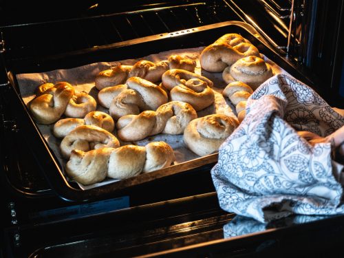 a hand taking out baked goods