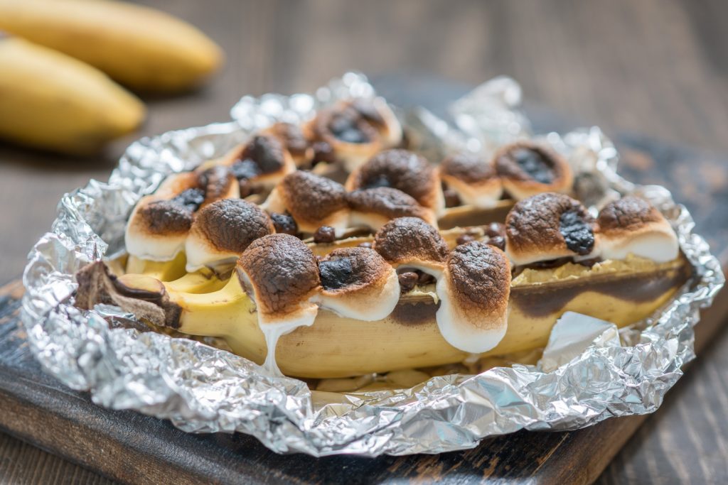 Campfire banana boats or roasted chocolate and marshmallow-stuffed bananas in foil.