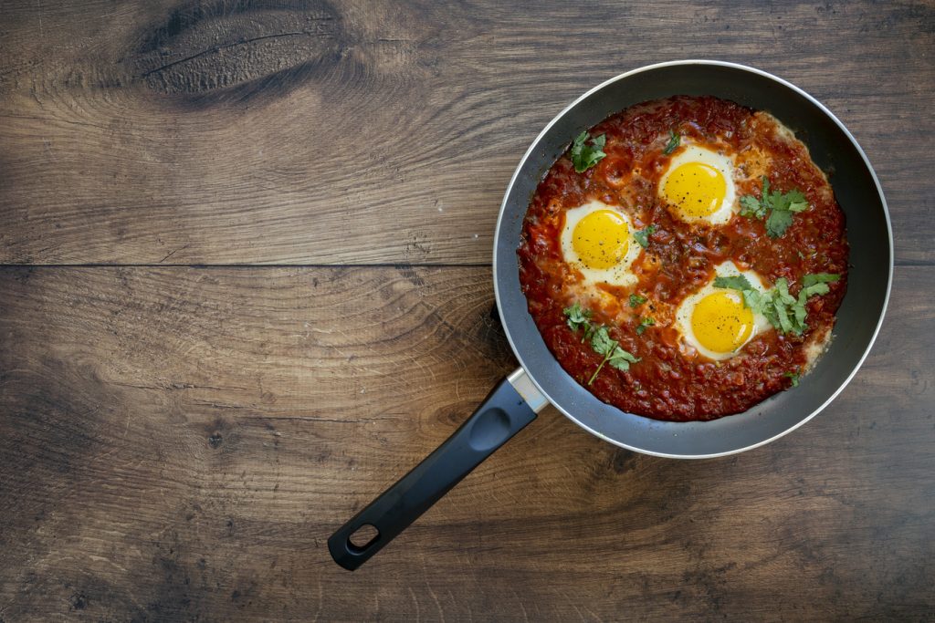 Poached Eggs in Spicy Tomato SAuce with room for copy