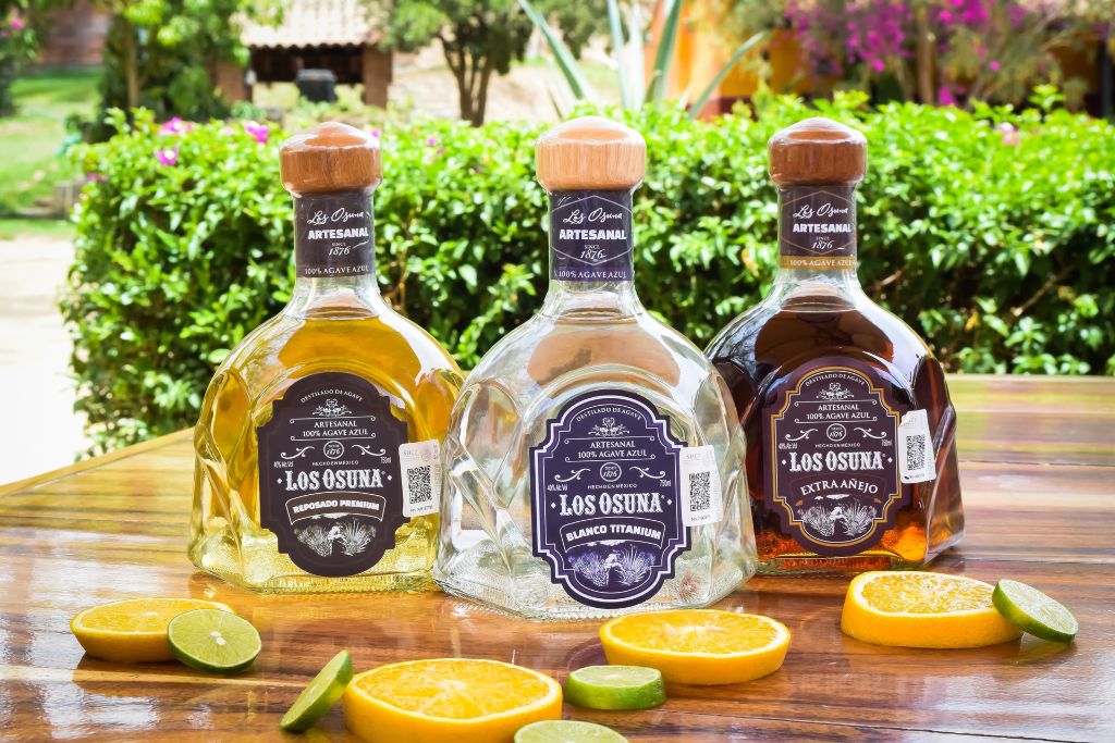 Three bottles of tequila which is a type of mezcal or agave-based spirit, mezcal vs tequila