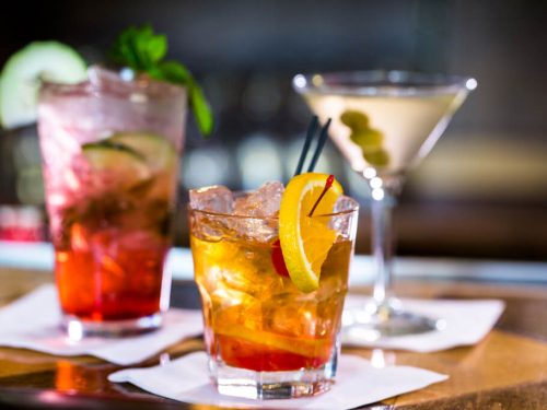 selection of cheap drinks on wooden table, cheap drinks