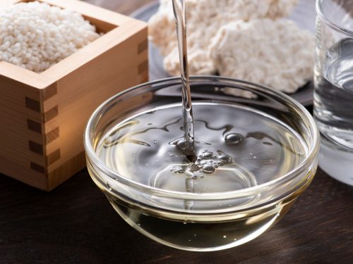 Pouring hon mirin into a small clear bowl, mirin substitute