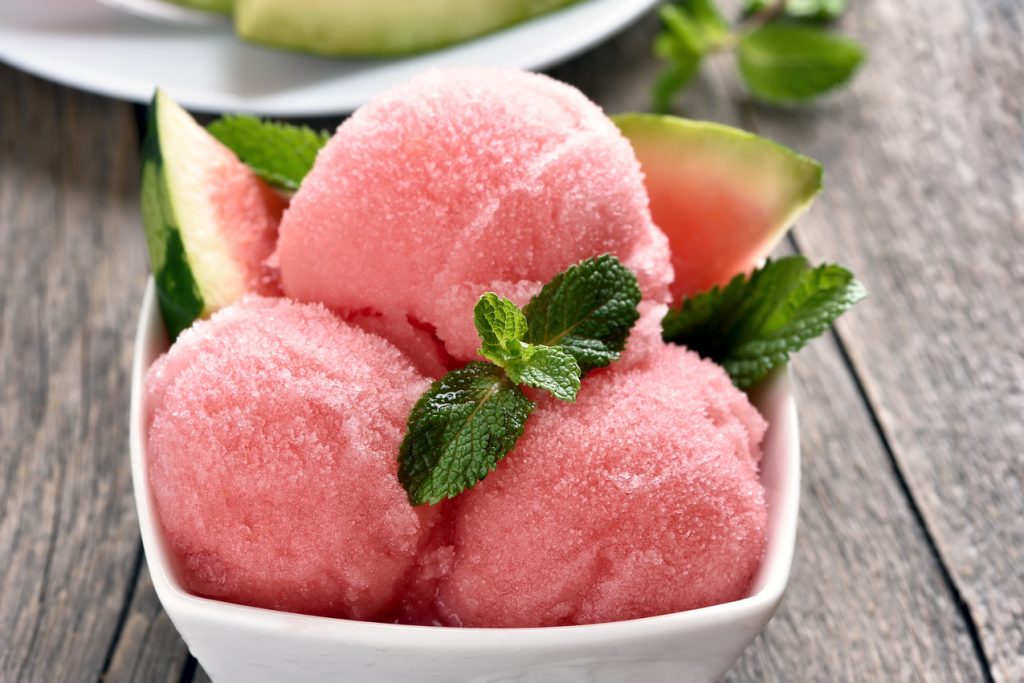 watermelon sorbet ice cream in bowl, close up view