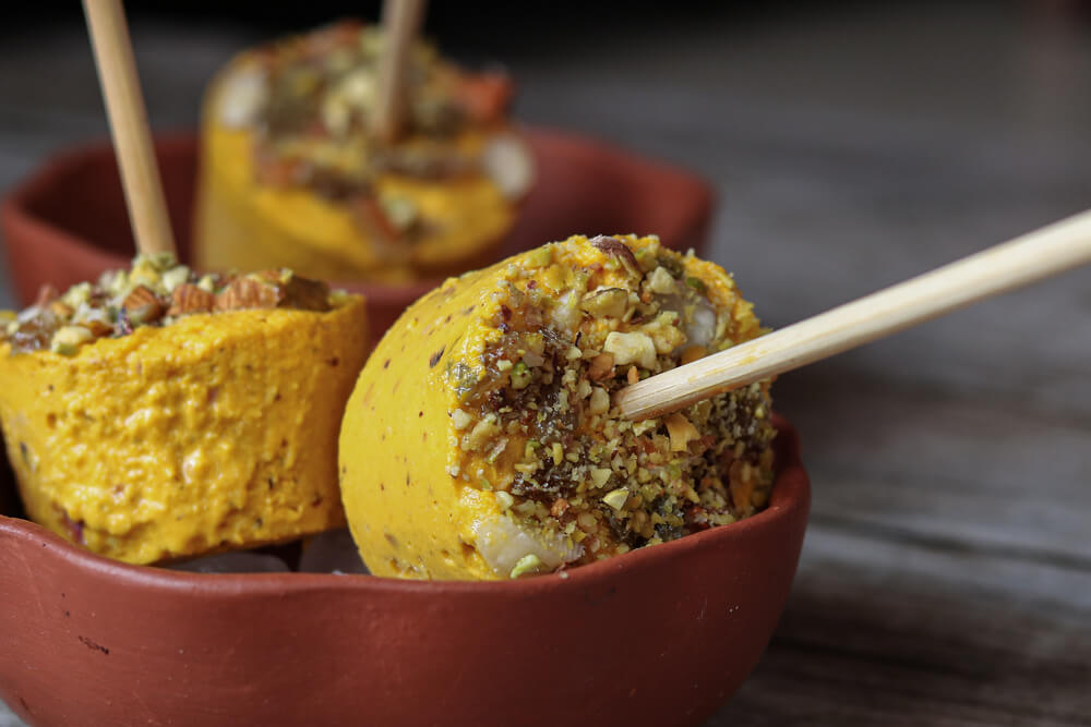 traditional mango kulfi in a stick