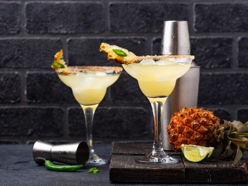 Two glasses of mezcal cocktails