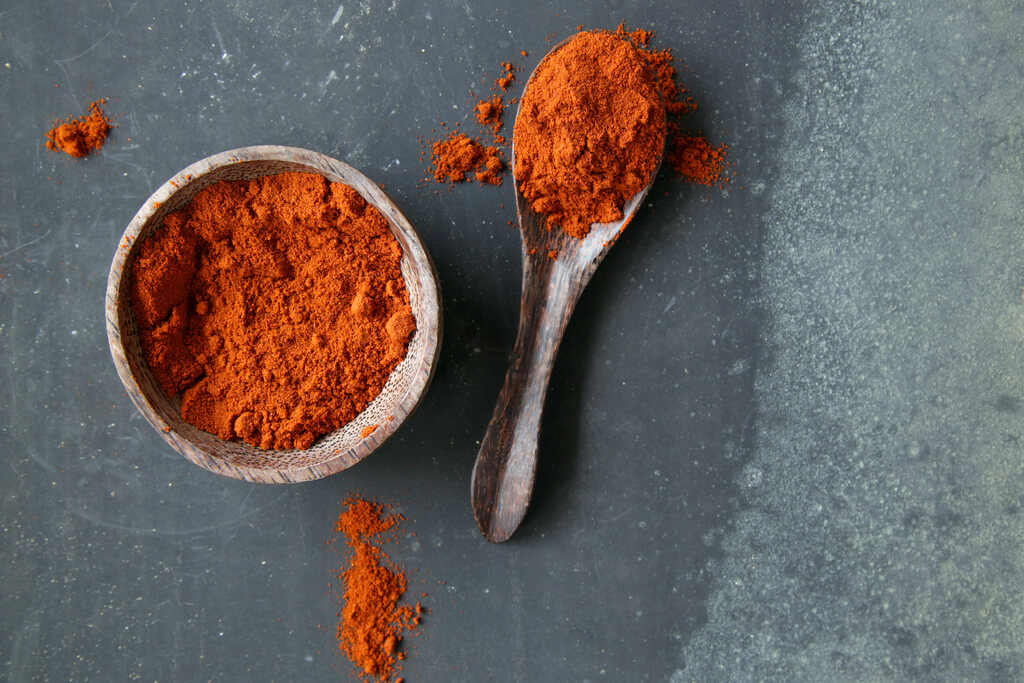 Paprika in a bowl and tablespoon