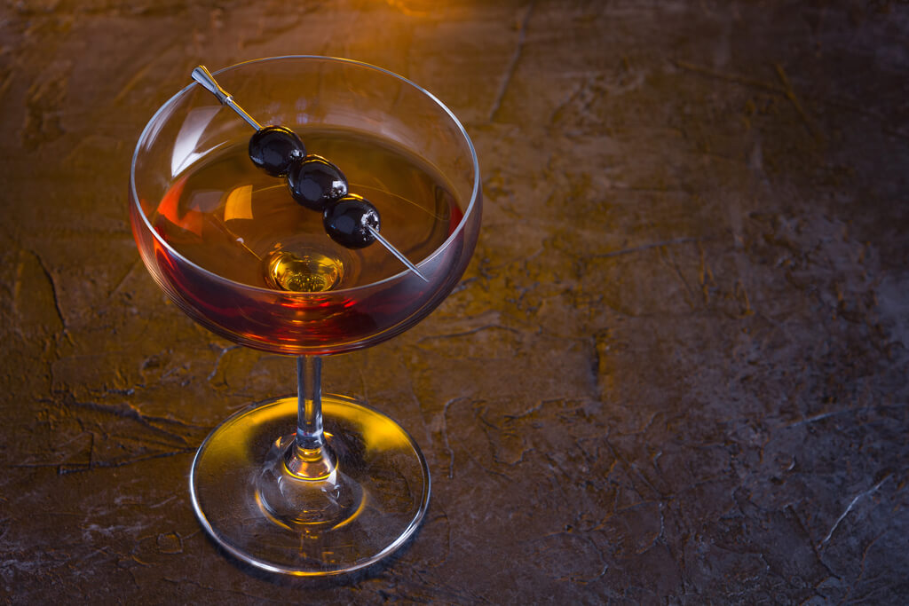 a glass of scotch cocktail