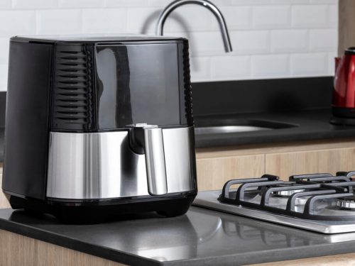 black air fryer on kitchen countertop