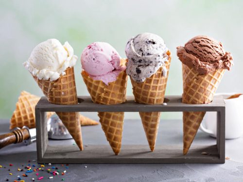 four ice cream cones on an ice cream cone holder