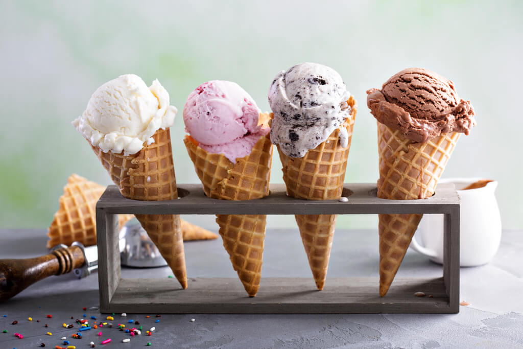 four ice cream cones on an ice cream cone holder