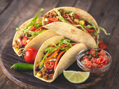 tacos on wooden board