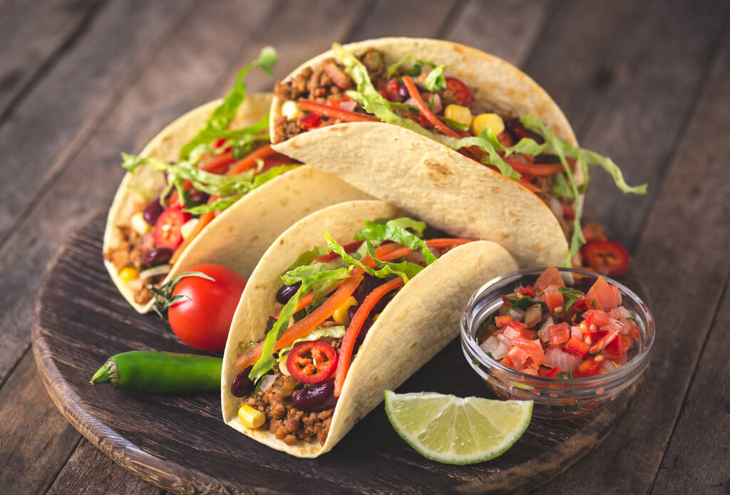 tacos on wooden board