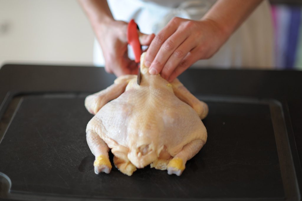 cutting chicken spine using poultry shears