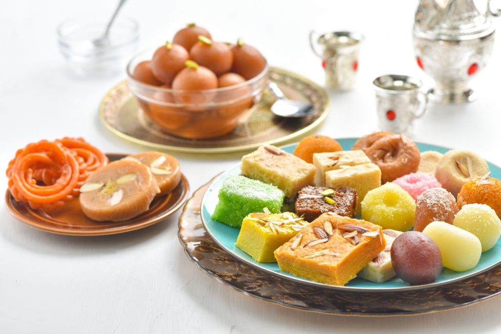 a spread of assorted sweet Indian desserts