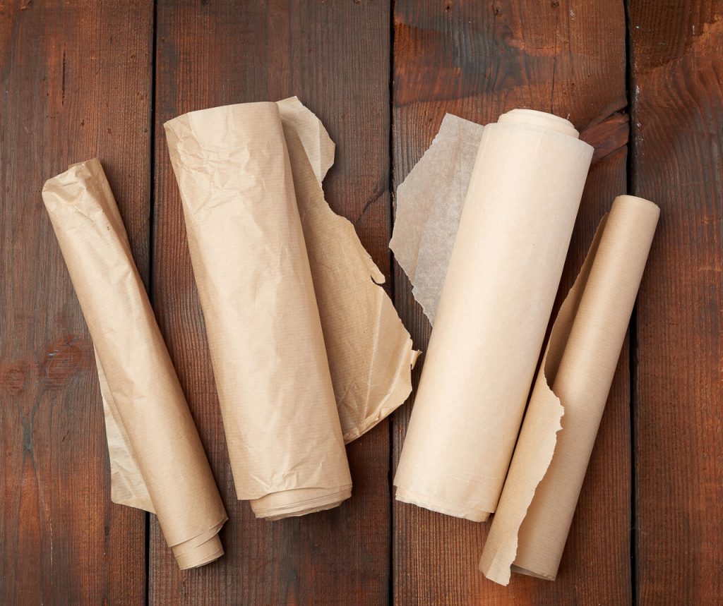 rolls of parchment paper on the counter, butcher paper vs parchment paper