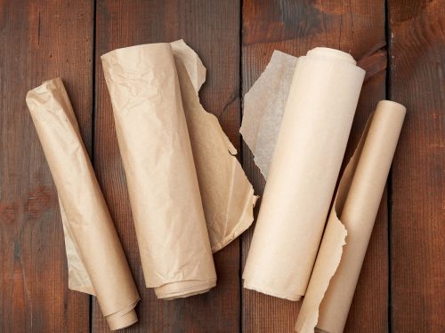 rolls of parchment paper on the counter, butcher paper vs parchment paper
