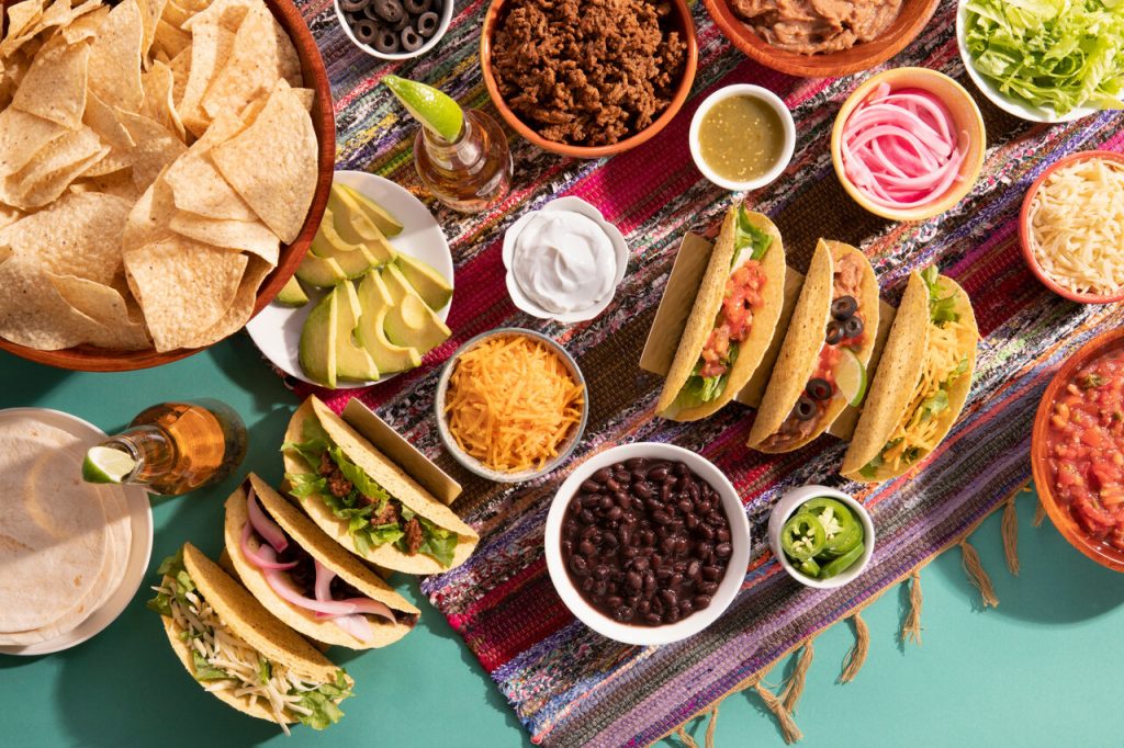 a spread of taco essentials for a taco bar, best taco toppings