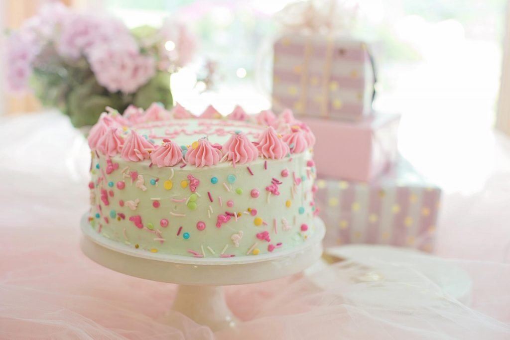 funfetti birthday cake on cake stand