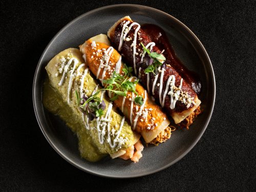 mexican enchiladas soaked in different sauces, enchilada vs burrito