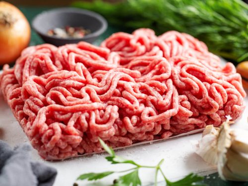 Ground beef with ingredients on the table