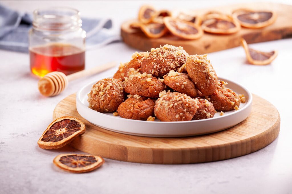 a plate of traditional Greek desserts known as melomakarona