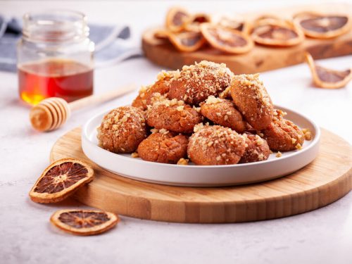 a plate of traditional Greek desserts known as melomakarona
