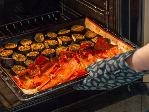 taking out baked veggies from the oven, baked vs broil