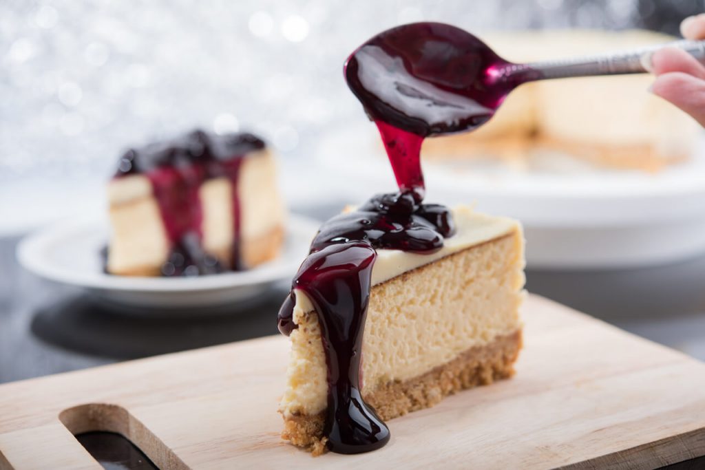 New York-style cheesecake topped with blueberry sauce