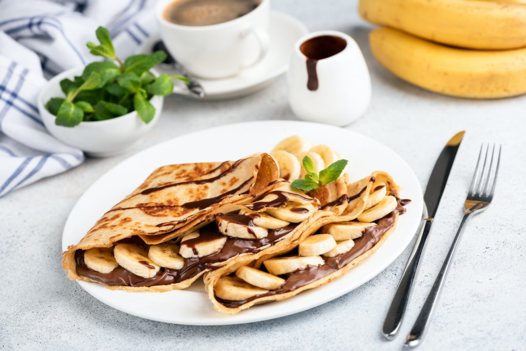 french crepes filled with chocolate syrup and banana slices, crepe fillings 