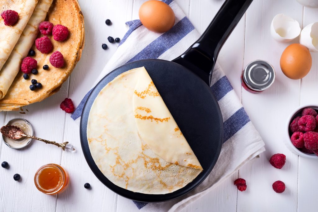 pancake maker surrounded by toppings and ingredients, best pancake maker