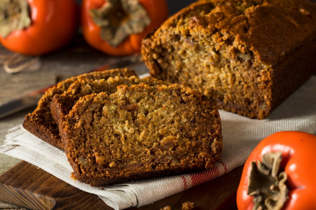 Persimmon Bread Recipe, Persimmon bread sliced and served on white plate