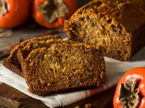 Persimmon Bread Recipe, Persimmon bread sliced and served on white plate