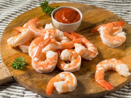 a plate of homemade shrimp appetizer with sauce, shrimp appetizers