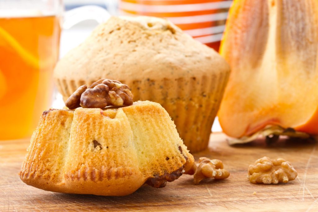 Spiced Persimmon Muffins, Muffins on brown board