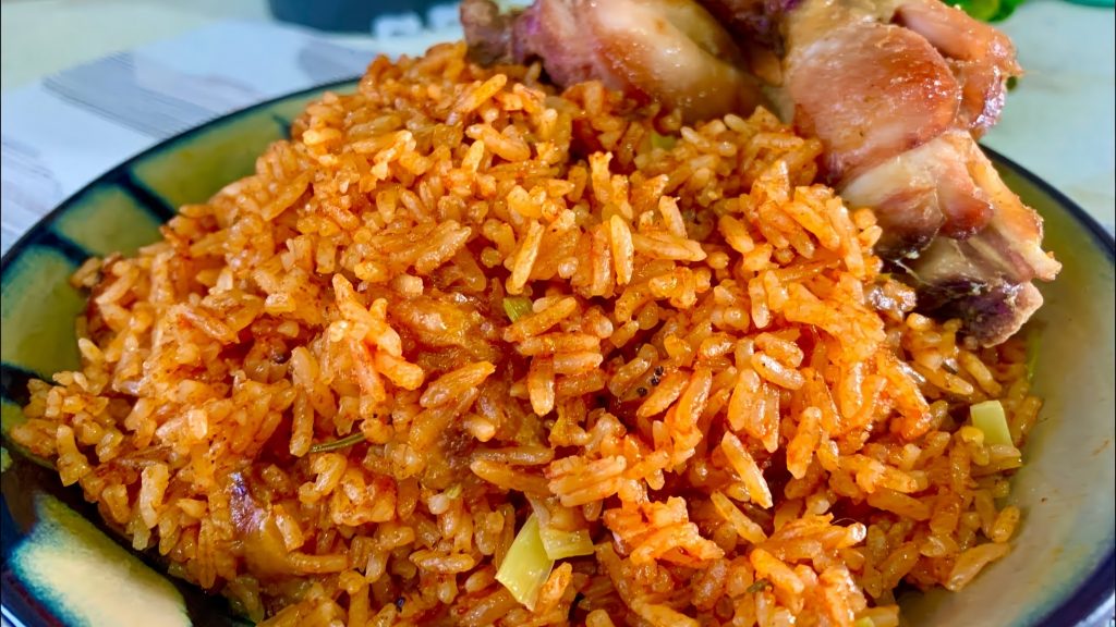 Nigerian Jollof Rice with Chicken and Fried Plantains