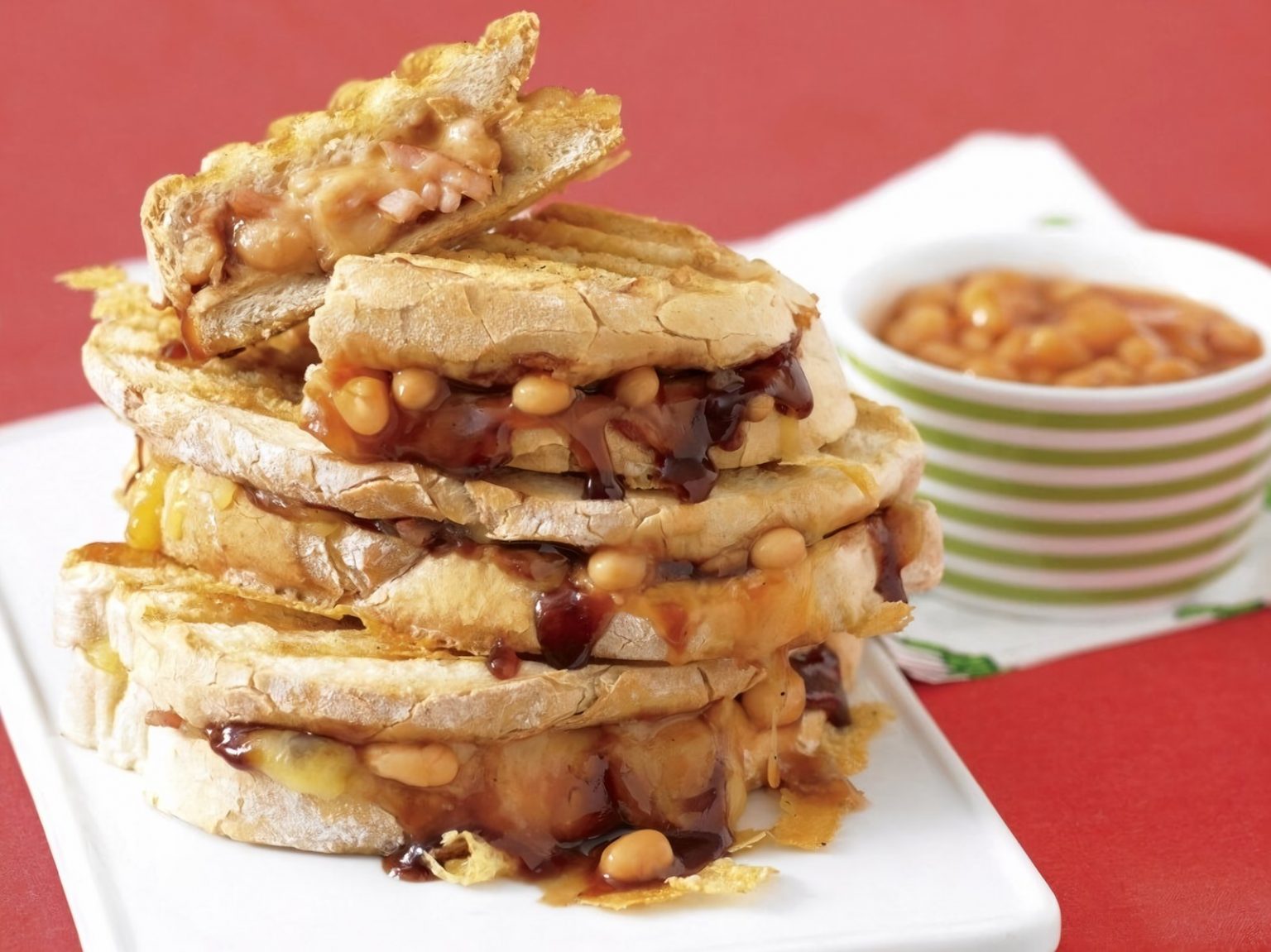 Smoky bean, bacon & eggy bread bake Recipe