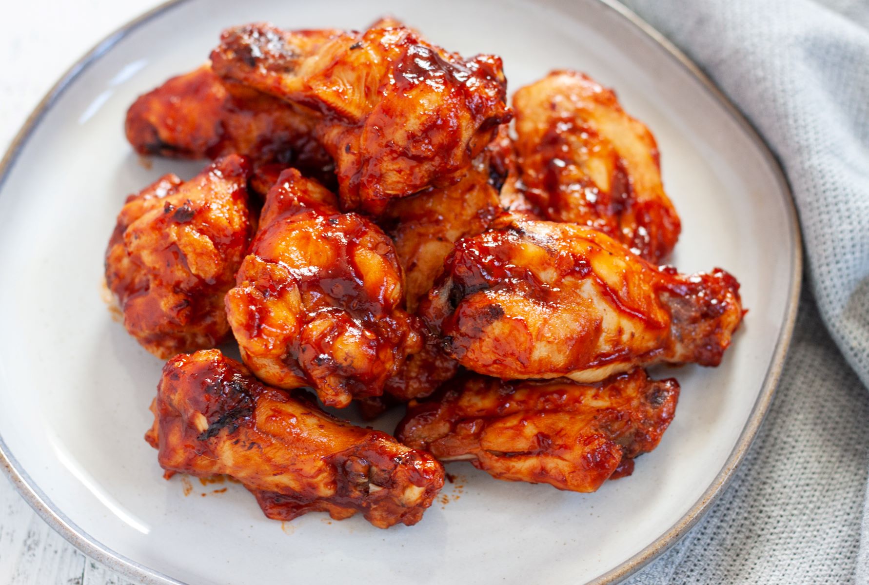 Frozen chicken wings in deep clearance fryer