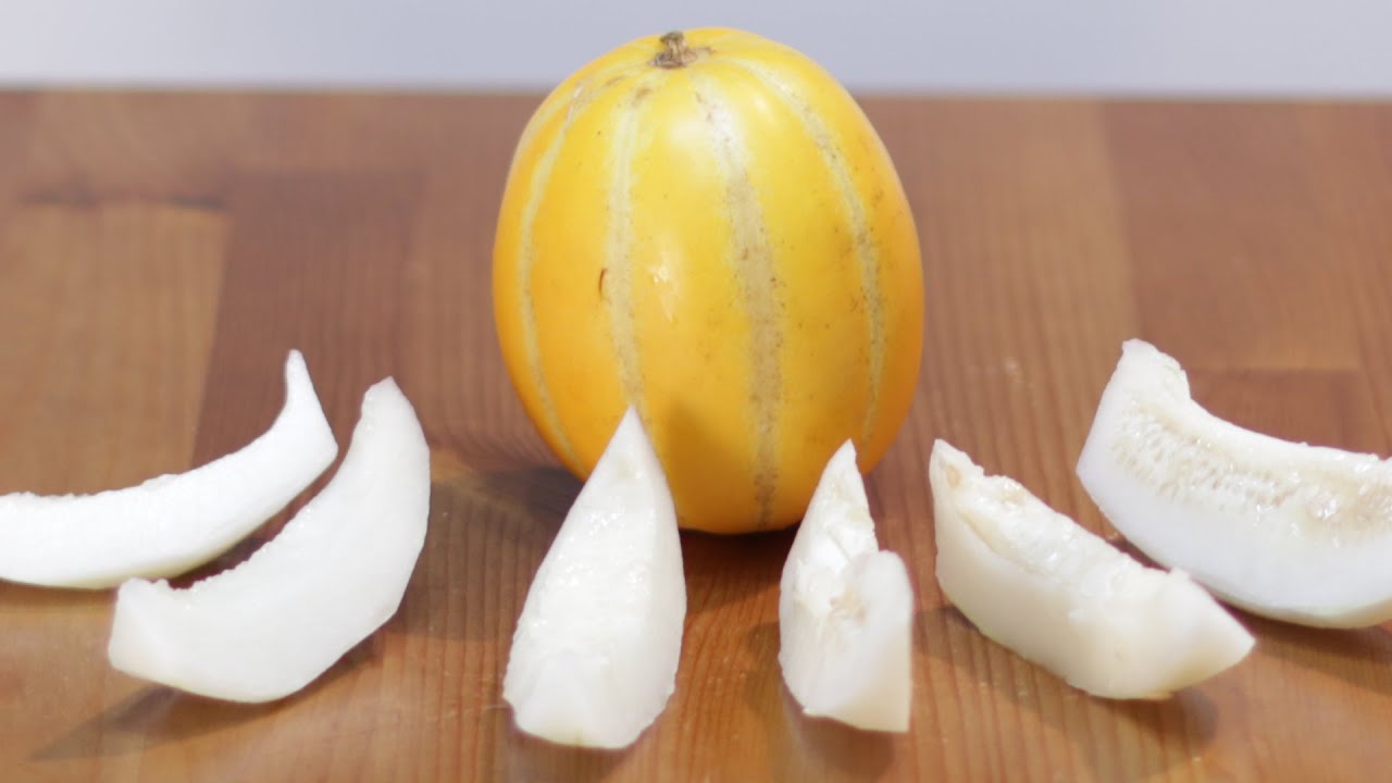how-to-eat-chinese-fruit-with-yellow-and-orange-stripes