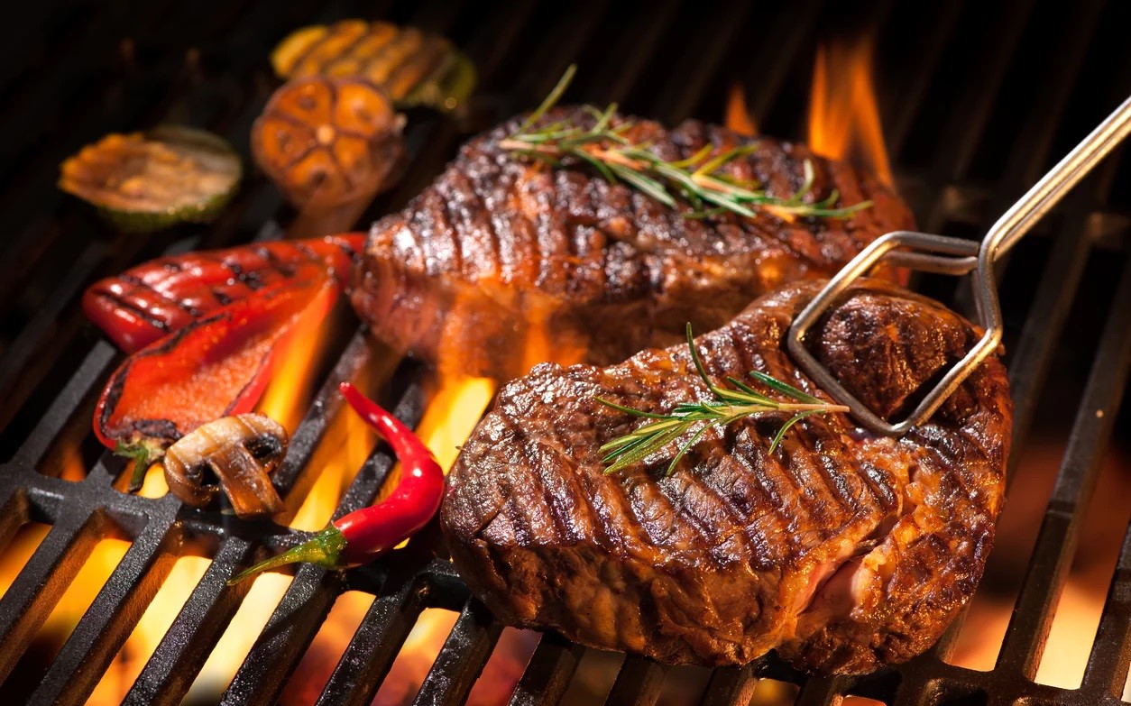 Steak on charcoal top grill