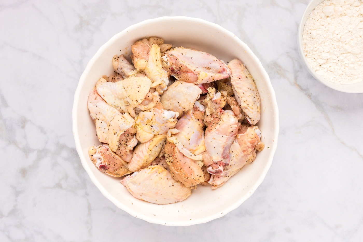 should i season chicken wings before frying