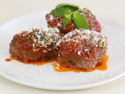 lamb meatballs with cumin, mint, and tomato sauce