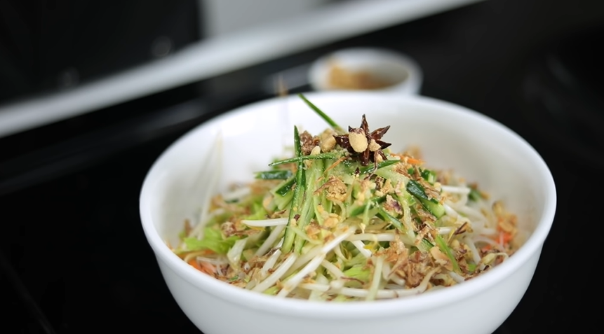 shredded cucumber, bean sprouts, and rice noodles in a bowl