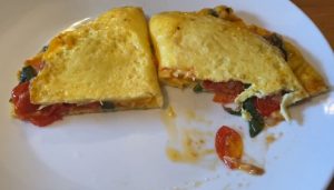 open-faced omelet with feta, roasted tomatoes, and spinach recipe